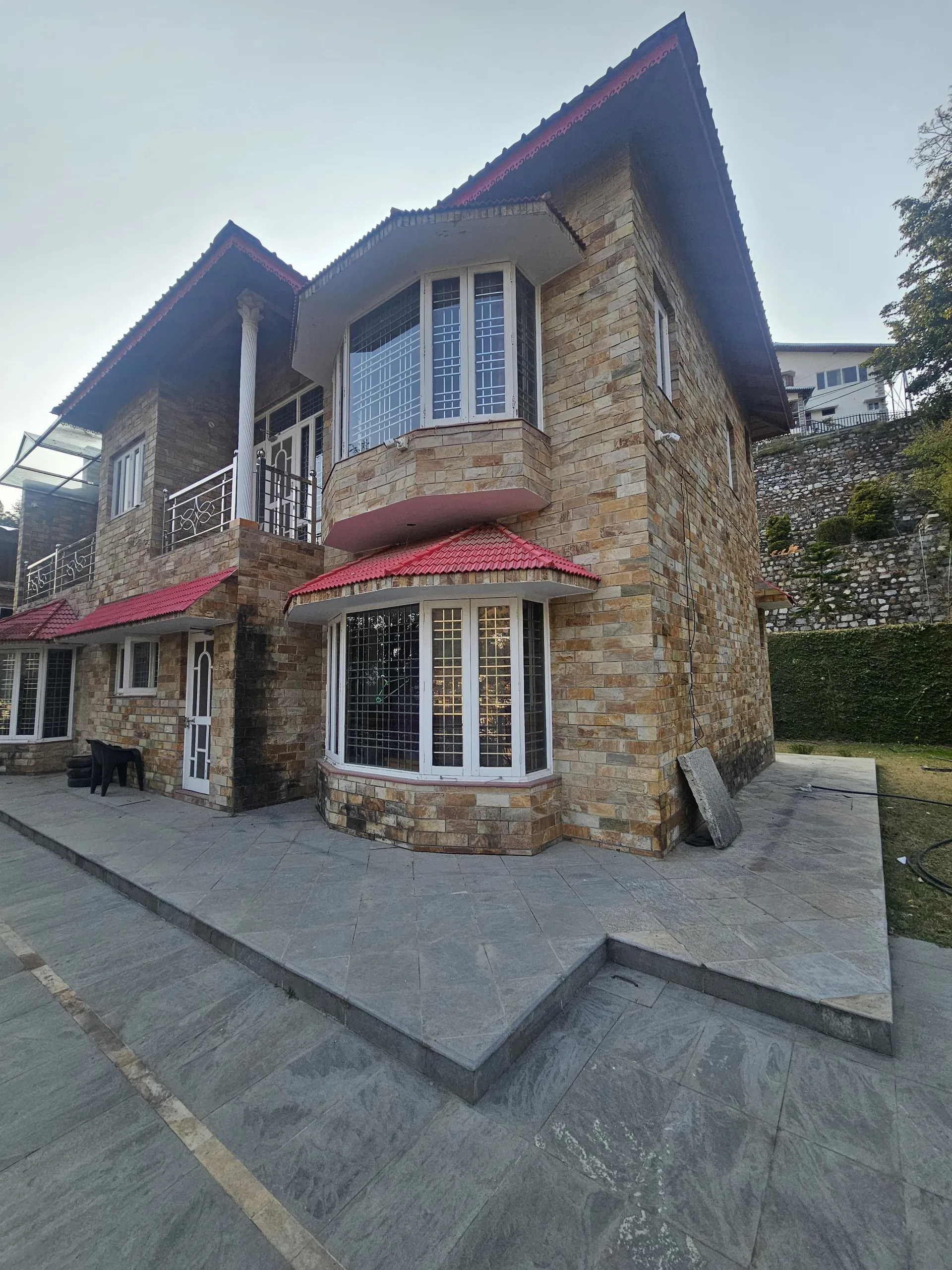 Sunlit terrace overlooking Bhimtal valley at Obhula Heights